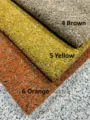 Nahaufnahme von strukturiertem Chenille-Bouclé-Stoff in Braun, Gelb und Orange. - 1 Meter / Orange