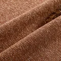 Gedetailleerde close-up textuur van dikke terracotta chenille meubelstof voor banken - Donkeroranje