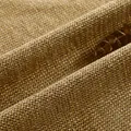 Detail van dikke gouden chenille stof met zachte getextureerde weving - Gembergeel