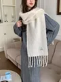 Soft cream wool blend scarf with elegant tassels and a minimalist brand label detail - Off White