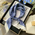 Elegant close-up view of a blue and white paisley silk scarf in vintage French style - Square Scarf / Vintage Blue Paisley (Paisley Pattern)