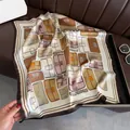 Detailed view of a vintage-style silk square scarf featuring a chic handbag pattern print. - Square Scarf / Cartoon Handbag Print