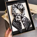 Close-up of black and white paisley silk scarf with elegant pattern detail - Square Scarf / Black Nepal Paisley (Paisley Print)