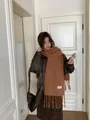 Asian model in a cozy brown wool-blend tassel scarf and leather jacket in a stylish indoor setting - Caramel color
