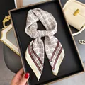 Close-up of a French retro silk scarf with geometric patterns on a black tray - Square Scarf / Coffee Brown Badge (Geometric Polka Dot)