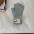 Soft mint green knitted winter gloves with a minimalist patch detail on ribbed cuffs - One Size / Mint Green