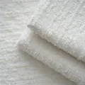 Close-up of cream chenille mountain-grain fabric with soft bouclé texture for upholstery - 2608-11米白雪绒