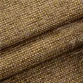 Close-up of thick coarse woven chenille fabric for sofa cushions in yellow and brown - Turmeric