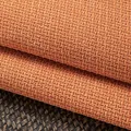 Close-up of thickened orange cotton linen sofa fabric with coarse woven texture - No.7 Orange