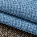 Close-up macro shot of thick blue cotton linen fabric showing coarse weave texture for upholstery - No.9 Sky Blue Plaid