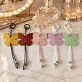 Porte-clés papillon minimalistes en cuir PU macaron en cinq couleurs pour sacs - Couleurs Mélangées Aléatoires