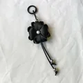 Handmade black ribbon four-leaf clover flower keychain with pearl accent for bags. - Black