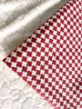 Classic red and white checkered thick linen fabric with woven houndstooth pattern texture - Brick Red