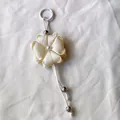 Elegant Chinese style clover flower bag charm with ribbon petals and pearl accent - Beige
