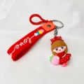 Detailed view of a cute cartoon girl holding a peach PVC keychain charm - Red