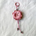 Handmade pink ribbon flower keychain and bag charm featuring a central pearl accent - Pink