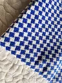 Detailed macro shot of blue and white houndstooth cotton linen upholstery fabric texture - Sapphire Blue