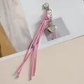 Porte-clés créatif avec gland en cordon de cire rose et pendentif cœur en argent - Rose