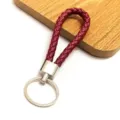 Macro detail of the burgundy braided leather texture on a metal keychain - 50 Pieces/Pack / Burgundy