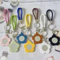 Porte-clés miroir fleur en cuir coloré avec sangles en corde tressée en variantes - Couleurs Mélangées Aléatoires