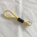 Close-up of yellow woven lanyard with black rubber grip and silver spring ring buckle - Yellow and Black Style (3)