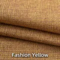Gros plan de tissu en lin jaune épais avec texture tissée visible pour l'ameublement - Jaune Chic
