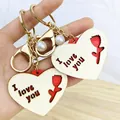Detailed view of heart-shaped wooden keychain with I love you cutout and pearl charm - Heart Style (Wooden Heart Keychain Pendant-001)