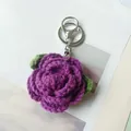 Handmade purple crocheted rose keychain charm with green leaves and silver clasp hook - Purple