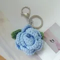 Elegant hand-crocheted light blue rose keychain with soft wool texture for schoolbags - Blue