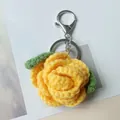 Handmade yellow crocheted rose flower keychain with green leaves for bags and gifts - Yellow
