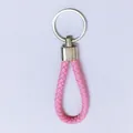 Pink braided leather cord keychain featuring a polished silver metal ring and loop - 50 Pieces/Pack / Pink
