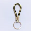 Stylish woven leather rope keychain in black and gold with silver-tone metal ring - 50 Pieces/Pack / Black and Gold