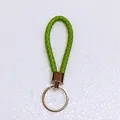 Vibrant green braided leather keychain with polished silver metal ring for car keys and bags. - 50 Pieces/Pack / Grass Green