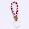 Handmade braided leather cord keychain in red, white, and blue colors for backpack pendant - 50 Pieces/Pack / Multicolor