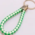 Woven leather rope keychain featuring a green and white braided pattern and metal ring - 50 Pieces/Pack / White and Green