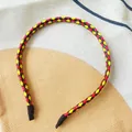 Stylish thin braided leather headband featuring vibrant red yellow and black patterns - Red Yellow Black Patchwork