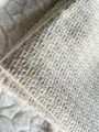 Close-up of textured cotton linen fabric with a beige and white grid pattern weave - Off White