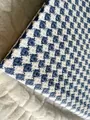 Macro view of blue and white houndstooth linen fabric for upholstery and sewing - Denim Blue