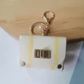 Retro cream leather mini bag keychain with yellow stripes and pearl detail - Beige