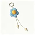 Portachiavi fiore all'uncinetto blu fatto a mano con accenti in perle di legno - Blu