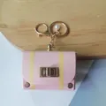 Pink vintage leather mini bag keychain charm with yellow stripes and pearl detail - Pink