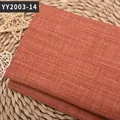Gros plan sur un tissu texturé en lin de couleur orange-rouge pour canapé et tapisserie - Rouge Brique (YY2003-14)