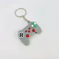 Mini grey silicone game controller keychain, creative retro gamepad accessory for bags and keys. - Gray