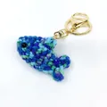 Handmade crochet clownfish keychain charm in mixed blue and green yarn for schoolbag decoration - Knitted Ocean Animal Style 3 (Pendant-3)
