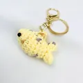 Handmade crochet yellow clownfish keychain featuring a golden metal ring and lobster clasp - Knitted Ocean Animal Style 4 (Pendant-4)