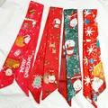 Detail of decorative Christmas-themed silk scarves with Santa and reindeer patterns. - Random Mixed Colors