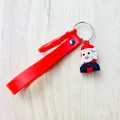 Detailed macro view showing a cute Santa Claus figure and red silicone strap on this holiday keychain - Santa Claus