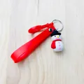 Detail of snowman charm and red silicone wrist strap on Christmas keychain pendant - Snowman / White