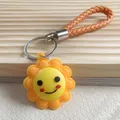 Simpatico portachiavi a forma di sole sorridente con cinturino intrecciato arancione - Stile Sole Con Cordino In Pelle