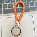 Llavero de cuerda de cuero trenzado naranja vibrante con anillo de plata pulida - Estilo Naranja